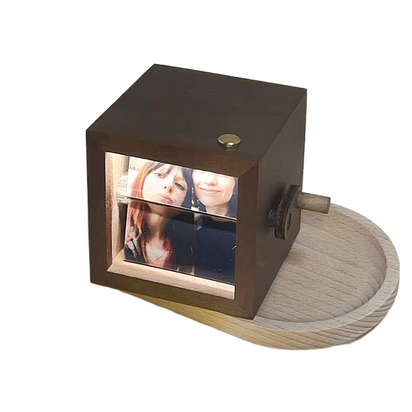 Light-emitting hand-cranked page-turning photo machine