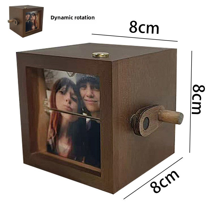 Light-emitting hand-cranked page-turning photo machine